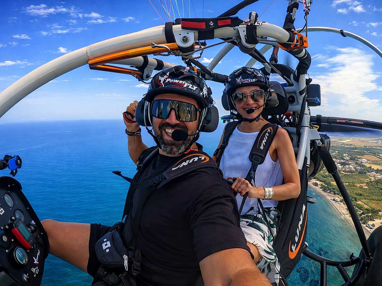 Tandem paratrike flying over the mountains near Chania, Crete